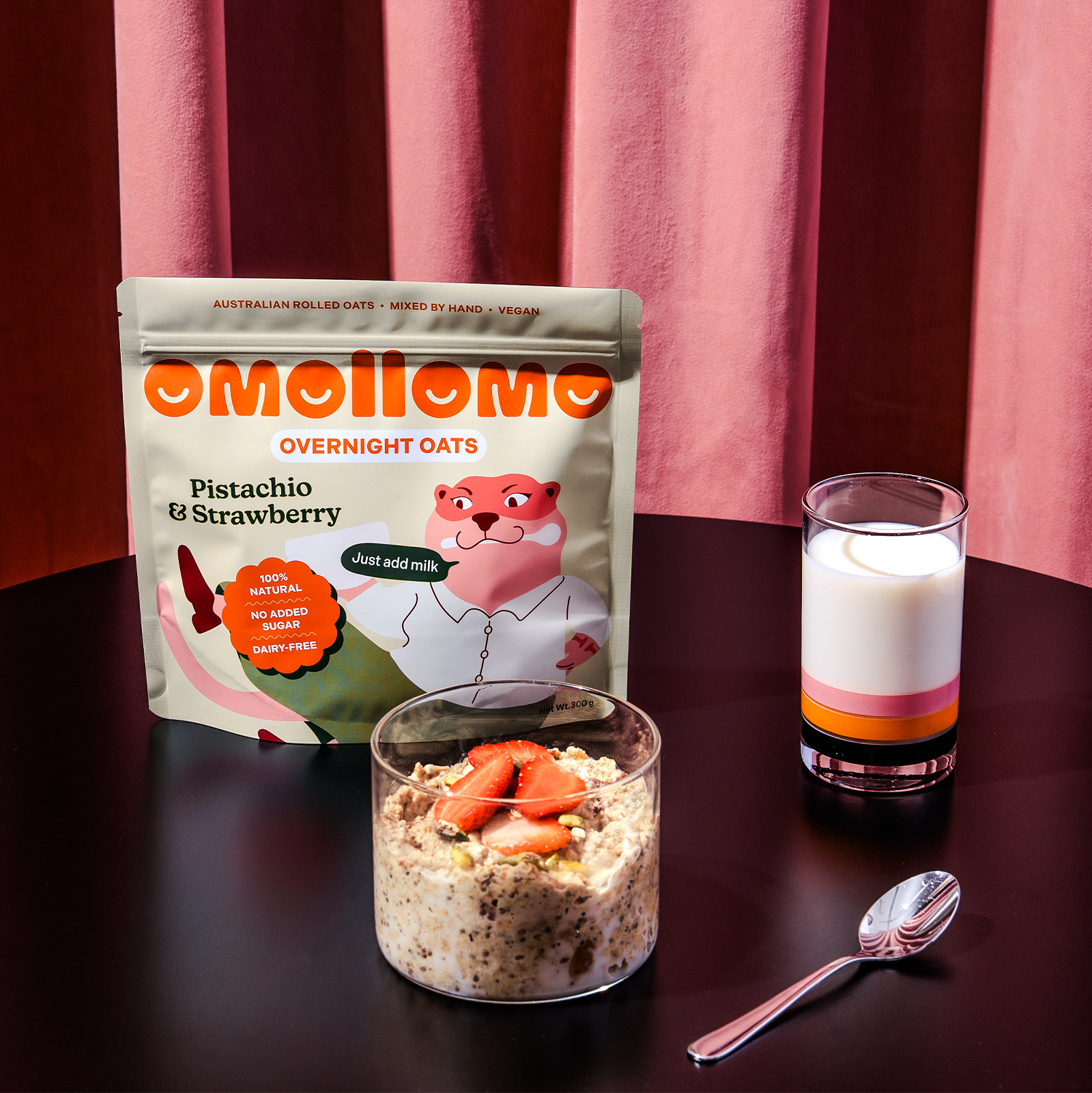 Omollomo Pistachio and Strawberry Overnight Oats served in a jar